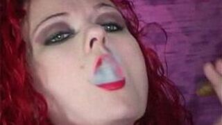 Redhead Melissa smokes a cigar while teasing us - porn video