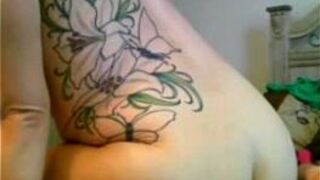 Babe with big tattoo has fun with her magic wand - porn video